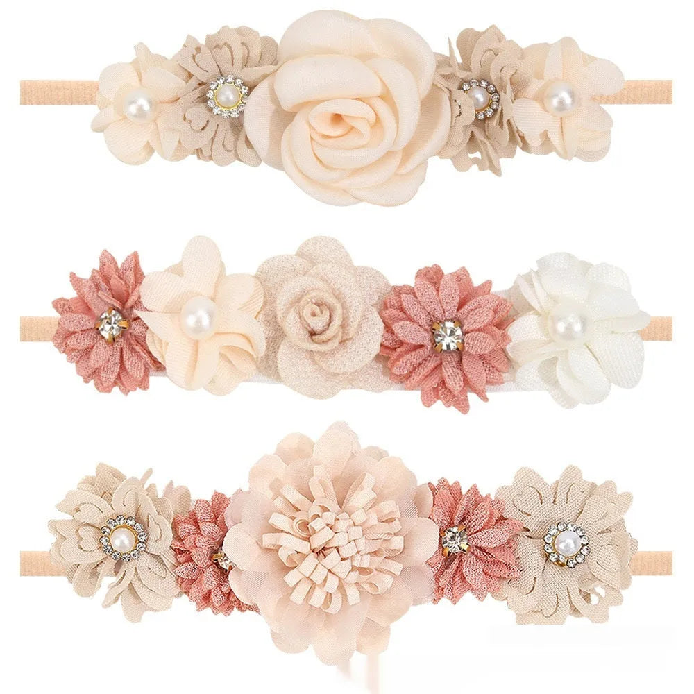 Set of three cloth flower-shaped baby hair bands in different styles