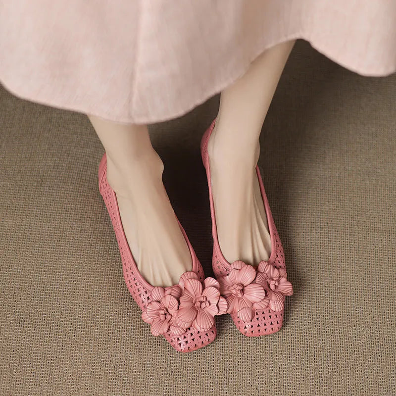 Women's light brown cowhide leather open weave pumps with a mid heel on a neutral background.