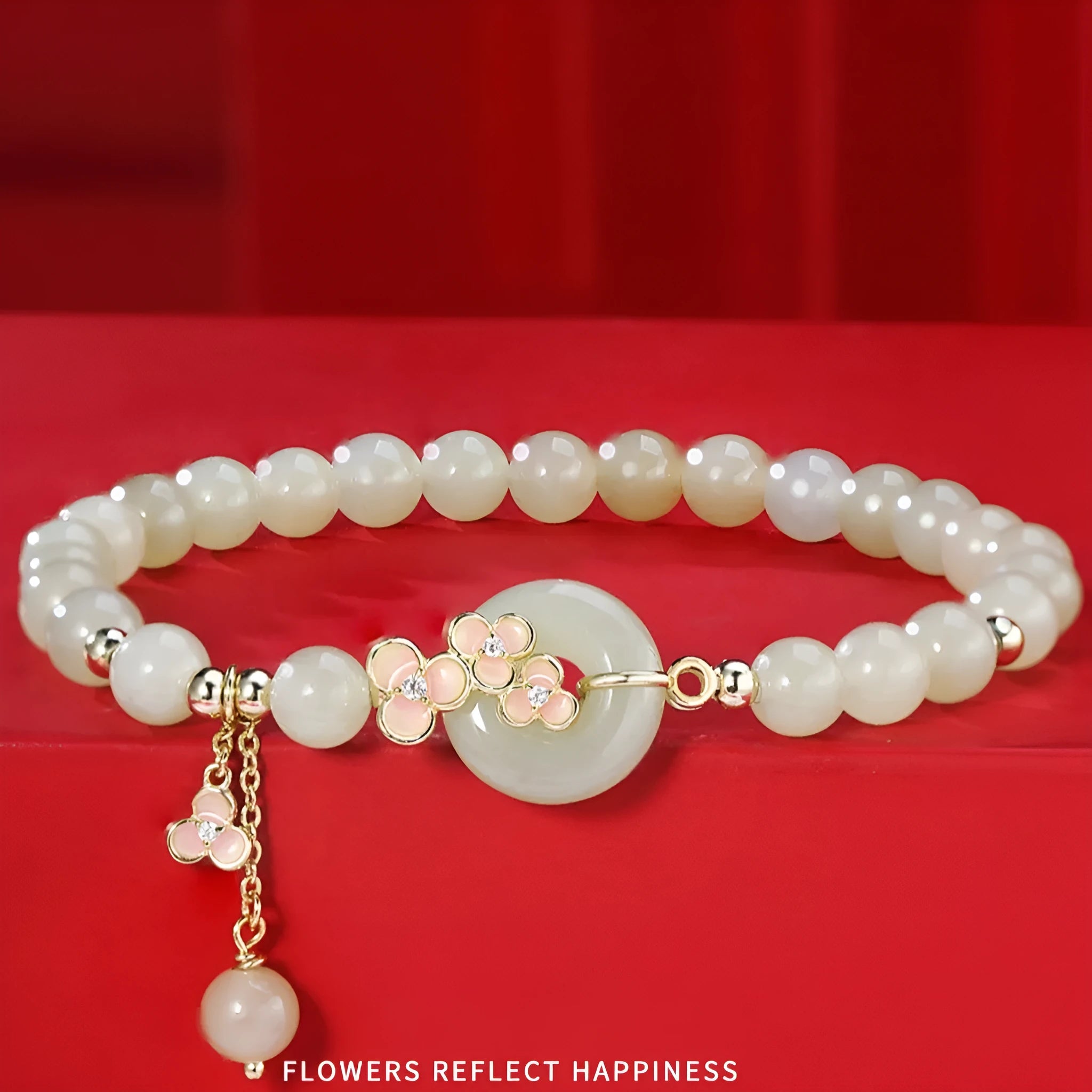 Peach blossom Hetian jade bracelet and necklace set with flower-shaped beads in sterling silver setting