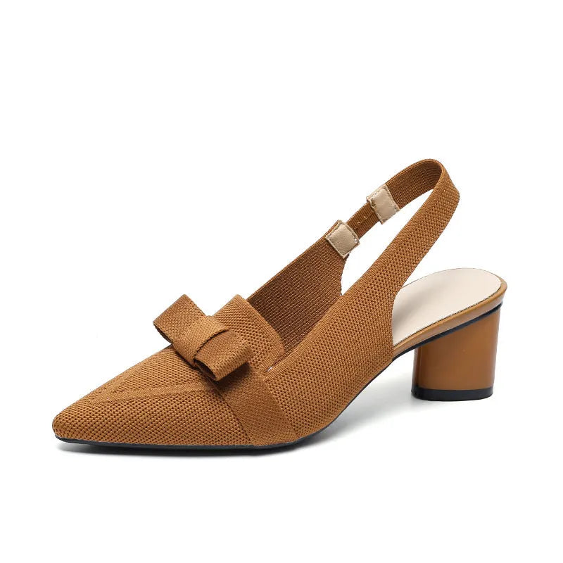 Women's closed toe high heel sandal with back ankle strap in a solid colour, showing pointed toe and fabric upper.