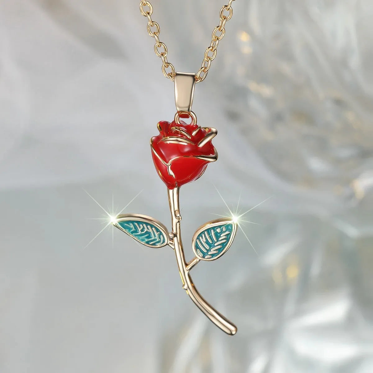 Close-up of a champagne gold rose-shaped copper pendant on an O-ring chain, with adjustable 41-50cm length.
