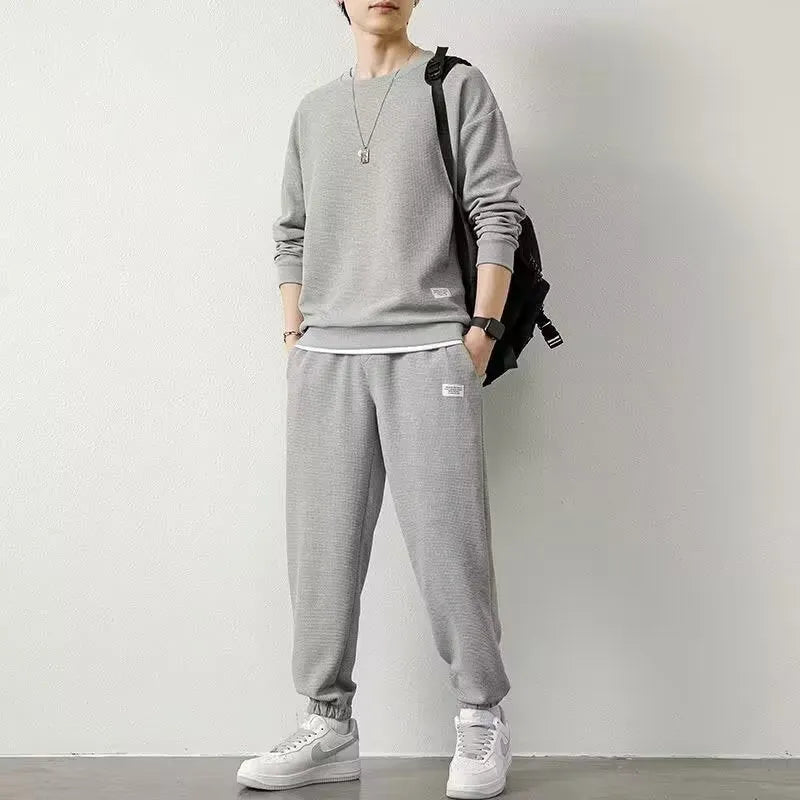 Long-sleeved waffle tracksuit set in nine colours, sizes L to 5XL, chemical fibre blend.