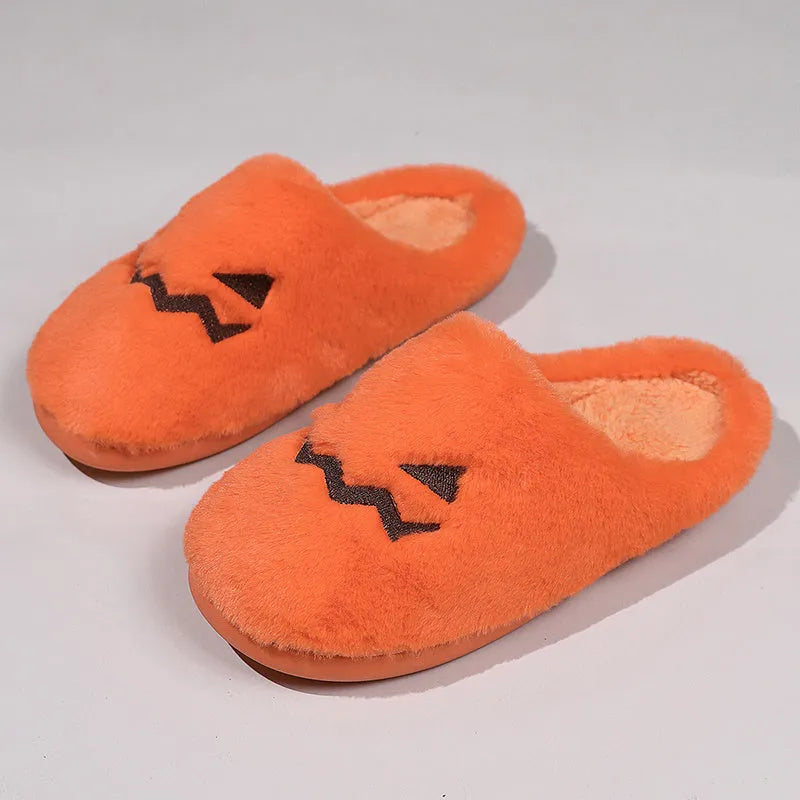 Orange coral velvet plush slippers with a non-slip PVC sole and fluffy lining.