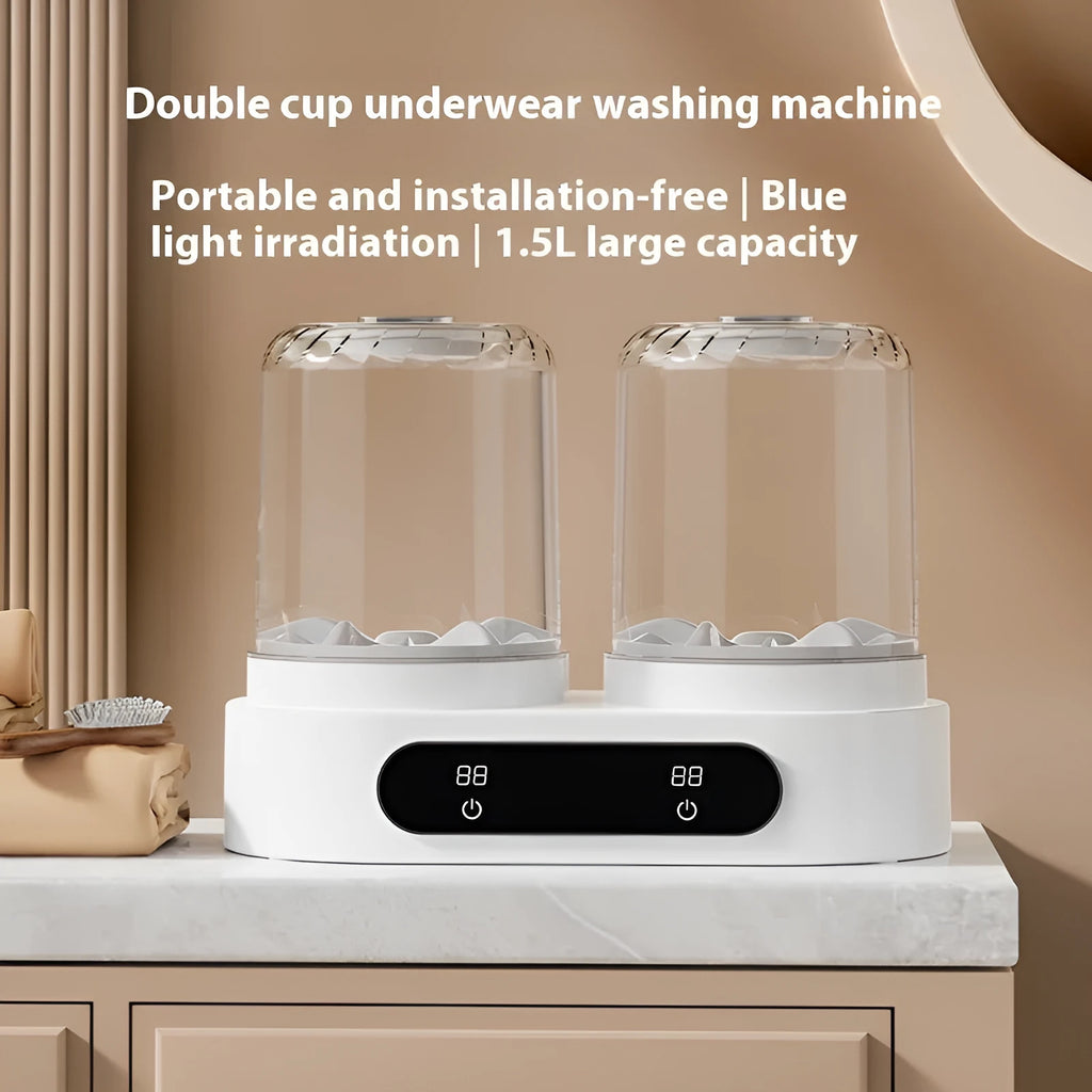 White double-bucket mini USB washing machine with two lids and a USB cable on a countertop.
