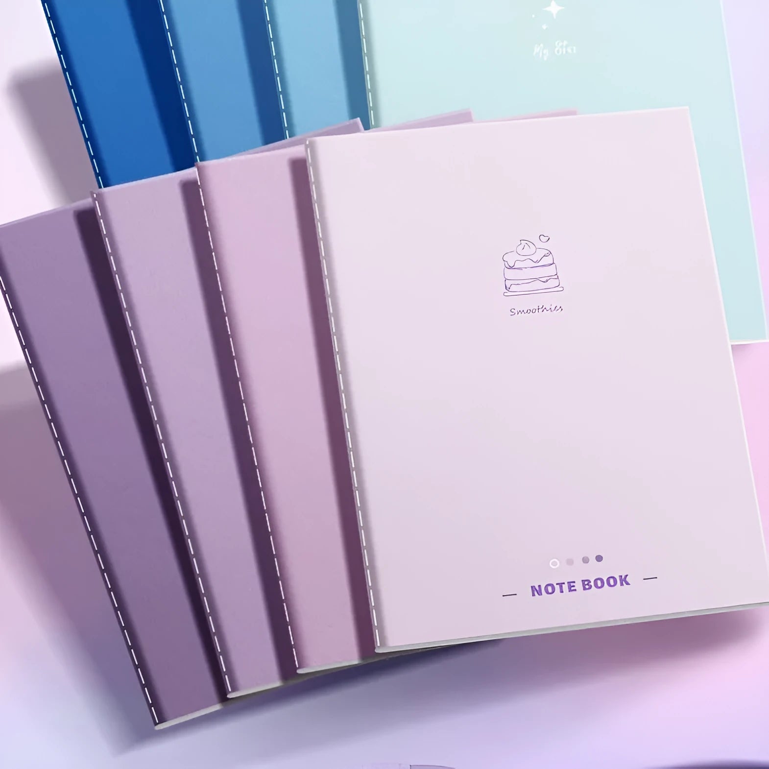 Set of 4 gradient colour notebooks with creative covers for student homework and learning.