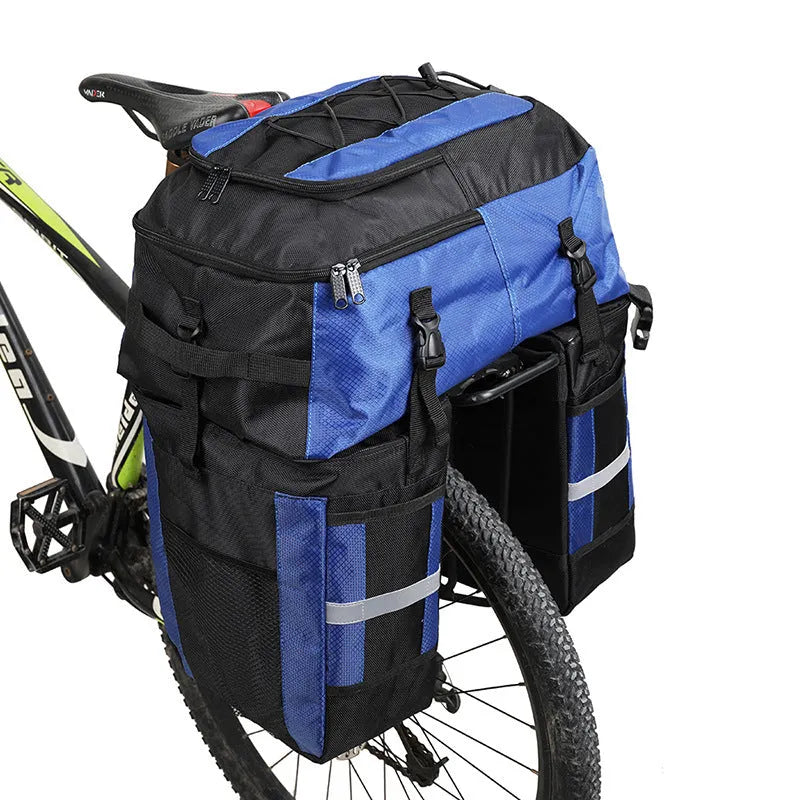 Green 70 litre bicycle rear storage frame bag mounted on a bike for touring.