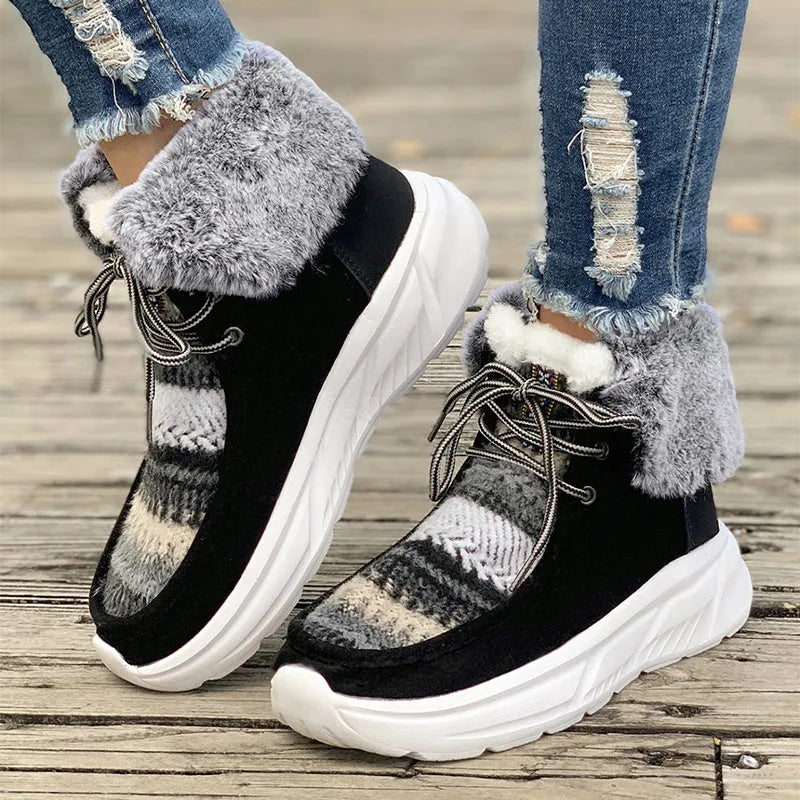 Women's beige lace-up suede snow boots with a thick rubber sole and plush lining, shown from the side.