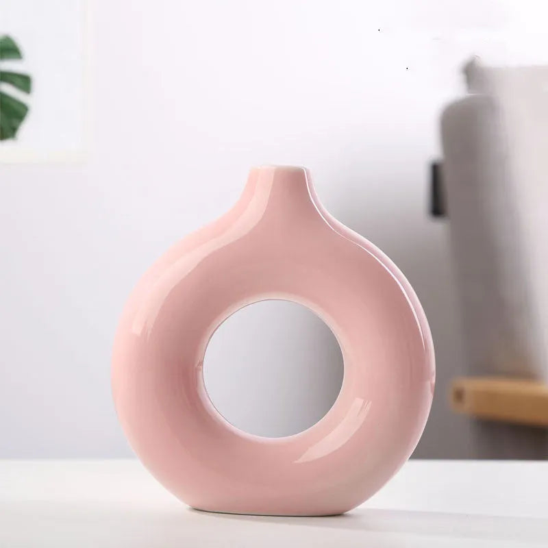 A simple modern frosted porcelain biscuit vase for flower arranging, shown in a neutral colour.