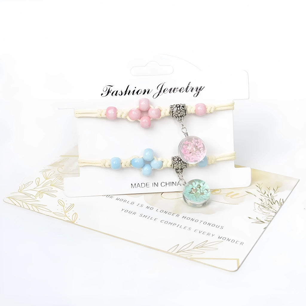 Close-up of a hand-woven glass bracelet with large 1.4cm beads containing real dried flowers.