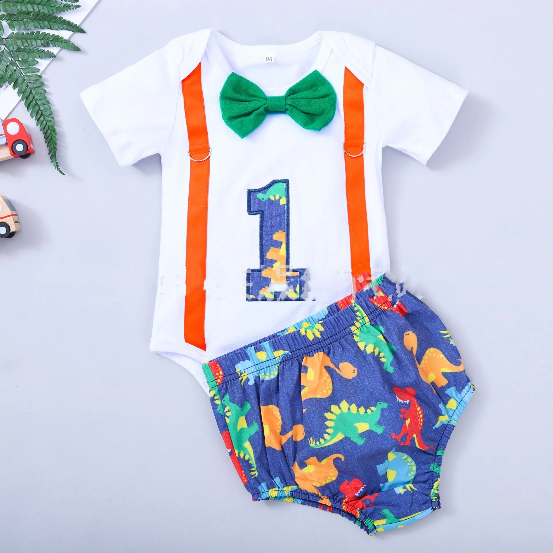 Cotton baby romper summer shorts with dinosaur pattern in blue and green colours