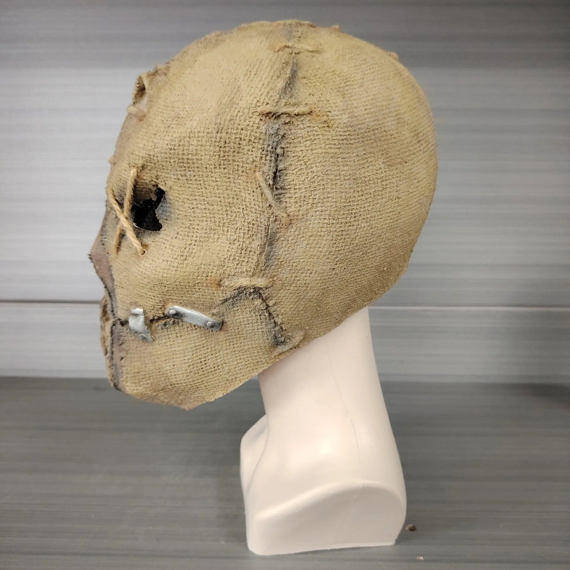 Latex Halloween horror mask showing detailed scar skull design as a full head cover.