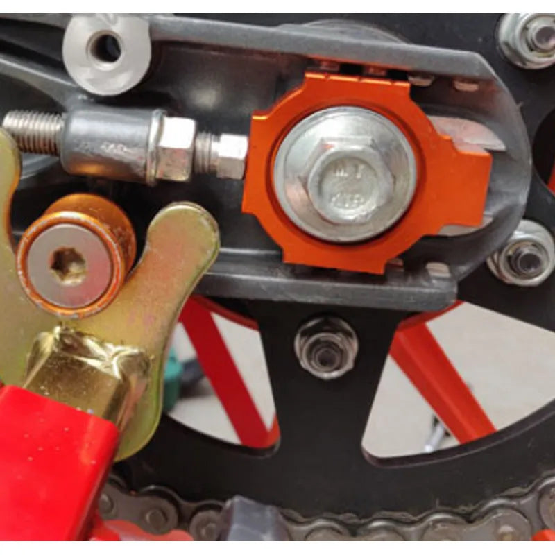 Orange KTM motorcycle rear fork regulator screw pair for Duke 200 390 990 models