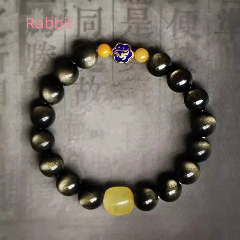 Golden obsidian ethnic bracelet with zodiac symbols on geometric 10mm stones