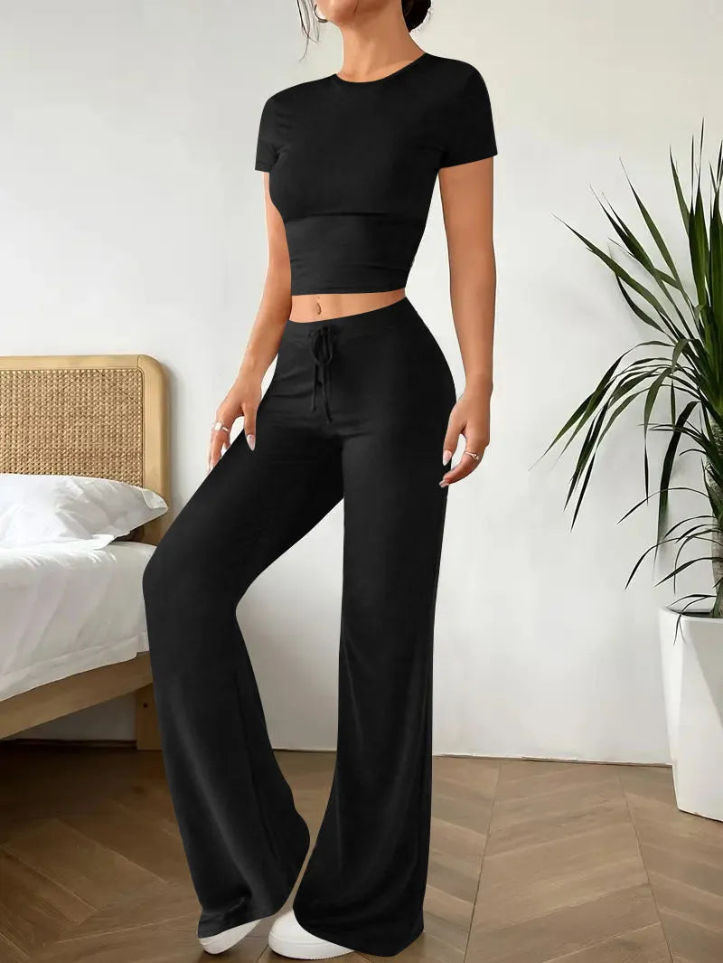Black high waist trousers and regular sleeve T-shirt co-ordinated suit set.
