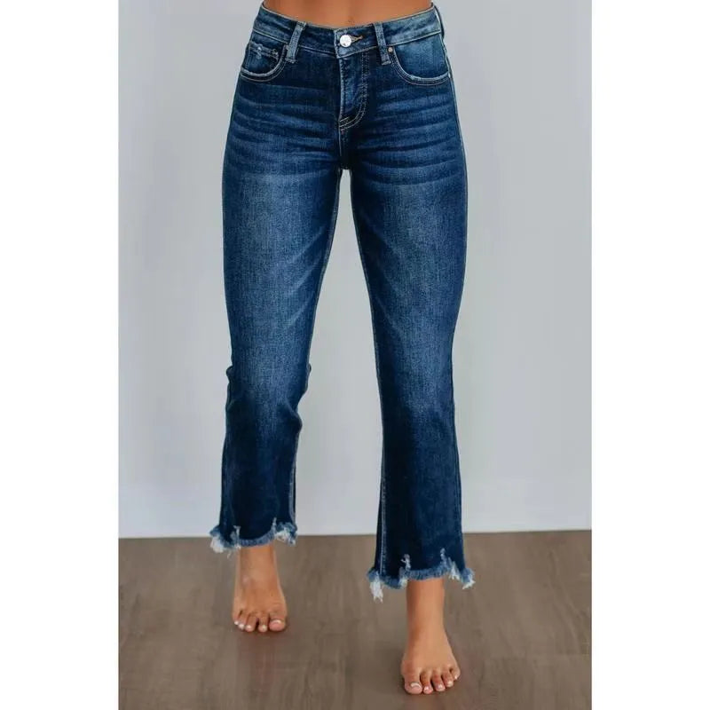 Women's solid colour denim pants with hand-worn distressing in dark blue and light blue.