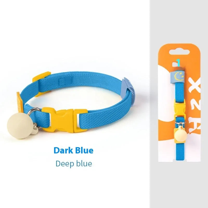 A small, elastic monochrome dog collar in sky blue with a plastic buckle, laid flat.