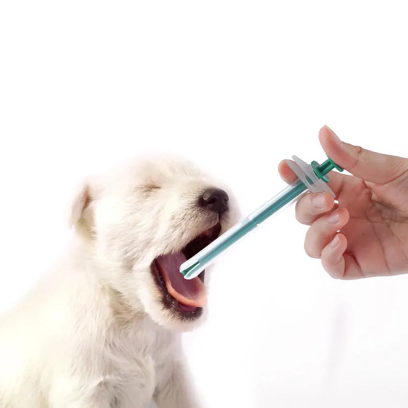 Two pet pill shooters with soft silicone tips, measuring 15cm and 11.5cm, for administering medication to cats and dogs