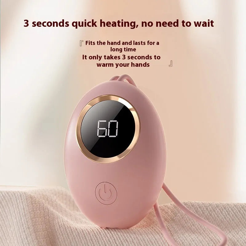 A digital display hand warmer power bank in a choice of colours, showing its USB port.