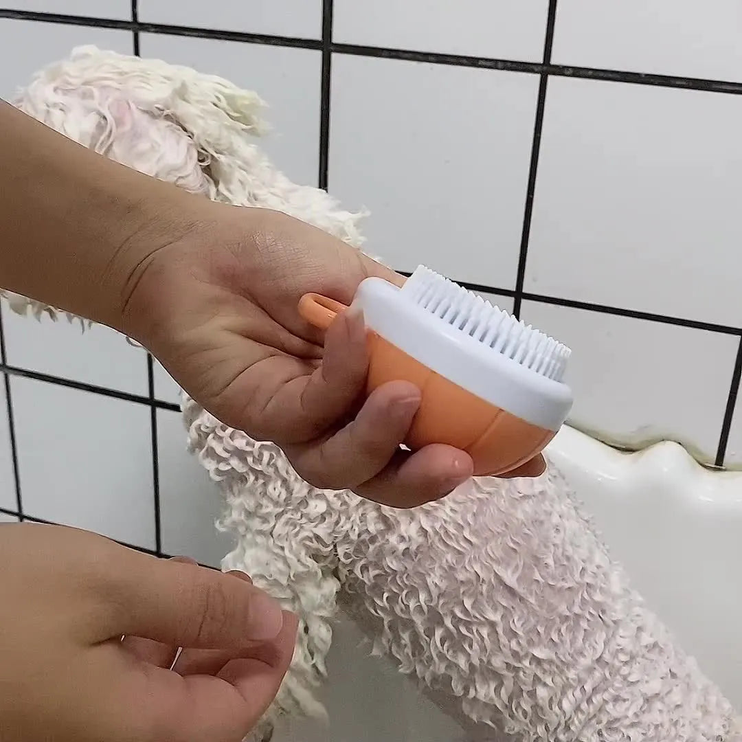 Orange TPR dog bath brush with shampoo dispenser and massage bristles