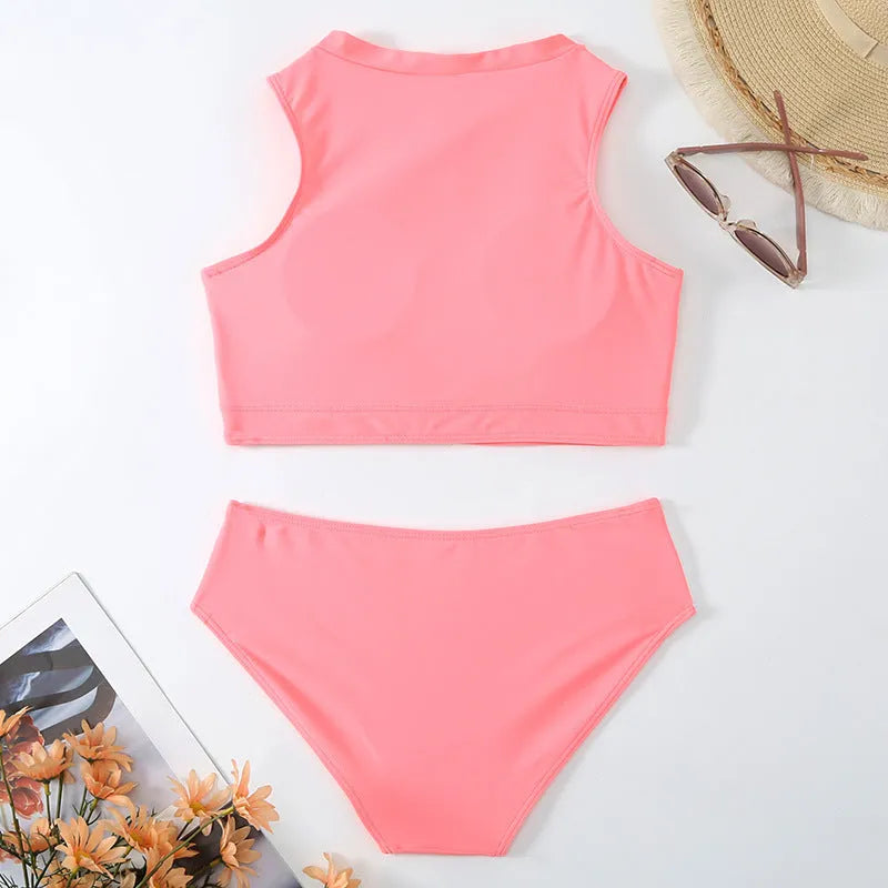 Pink high-waist bikini swimsuit set with brief bottoms and a matching bra on a mannequin.