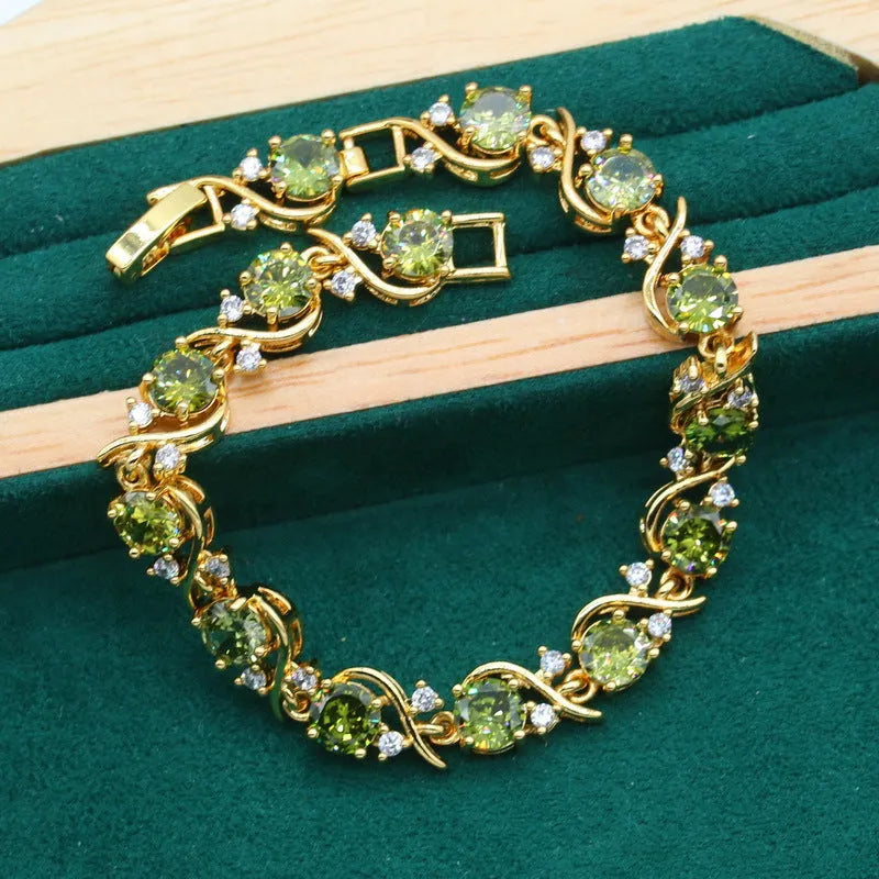 Women's zircon jewellery set with rhinestone decoration on snake bones chain in olive green colour