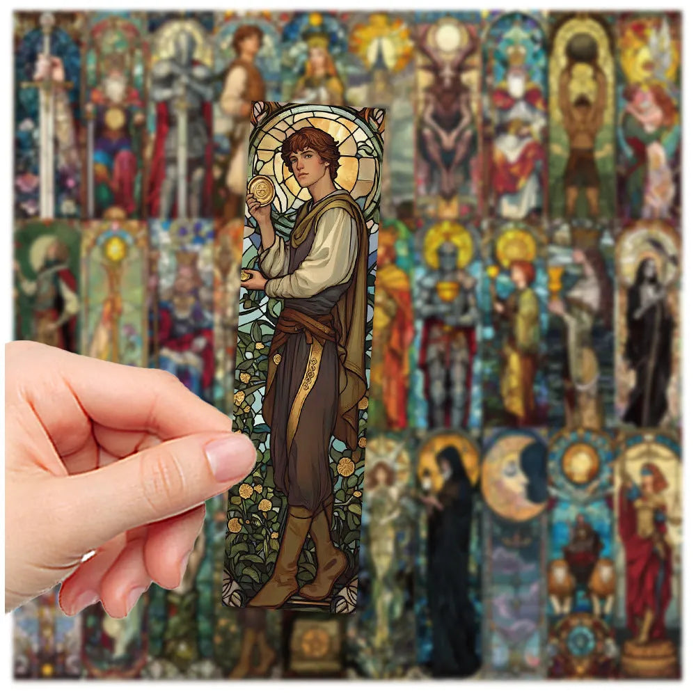Set of 30 colourful painted glass tarot design paper bookmarks laid out flat.