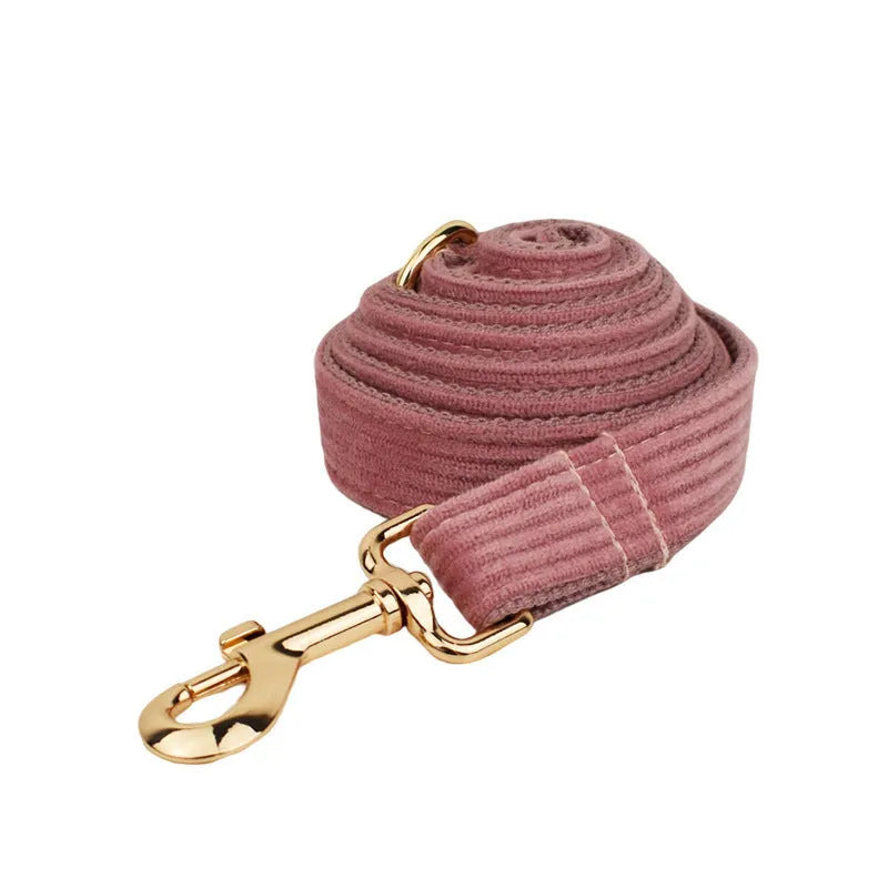 Corduroy dog collar and leash five-piece set with vest, bow, and poop bag in red.