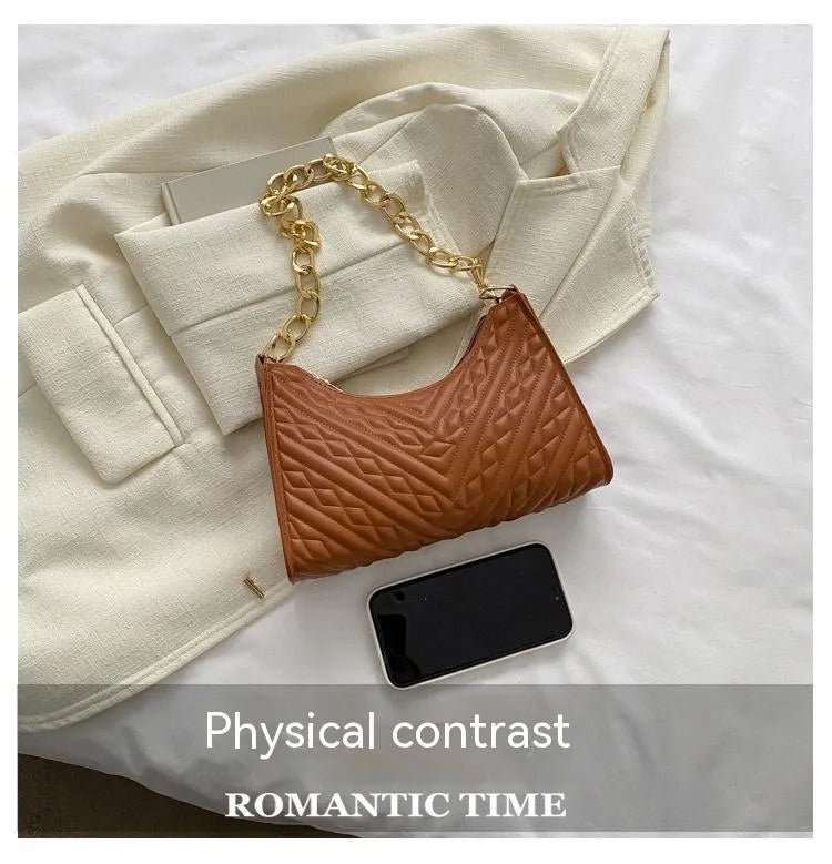 Black PU leather pleated square baguette bag with chain shoulder strap and top handle.