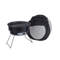 Small folding round metal ice stove with grill mesh and legs set up for outdoor barbecuing.