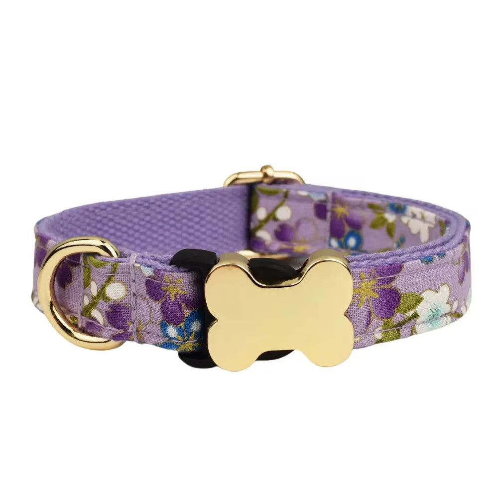 Nylon dog collar with a printed grid pattern and a large bone-shaped metal buckle.
