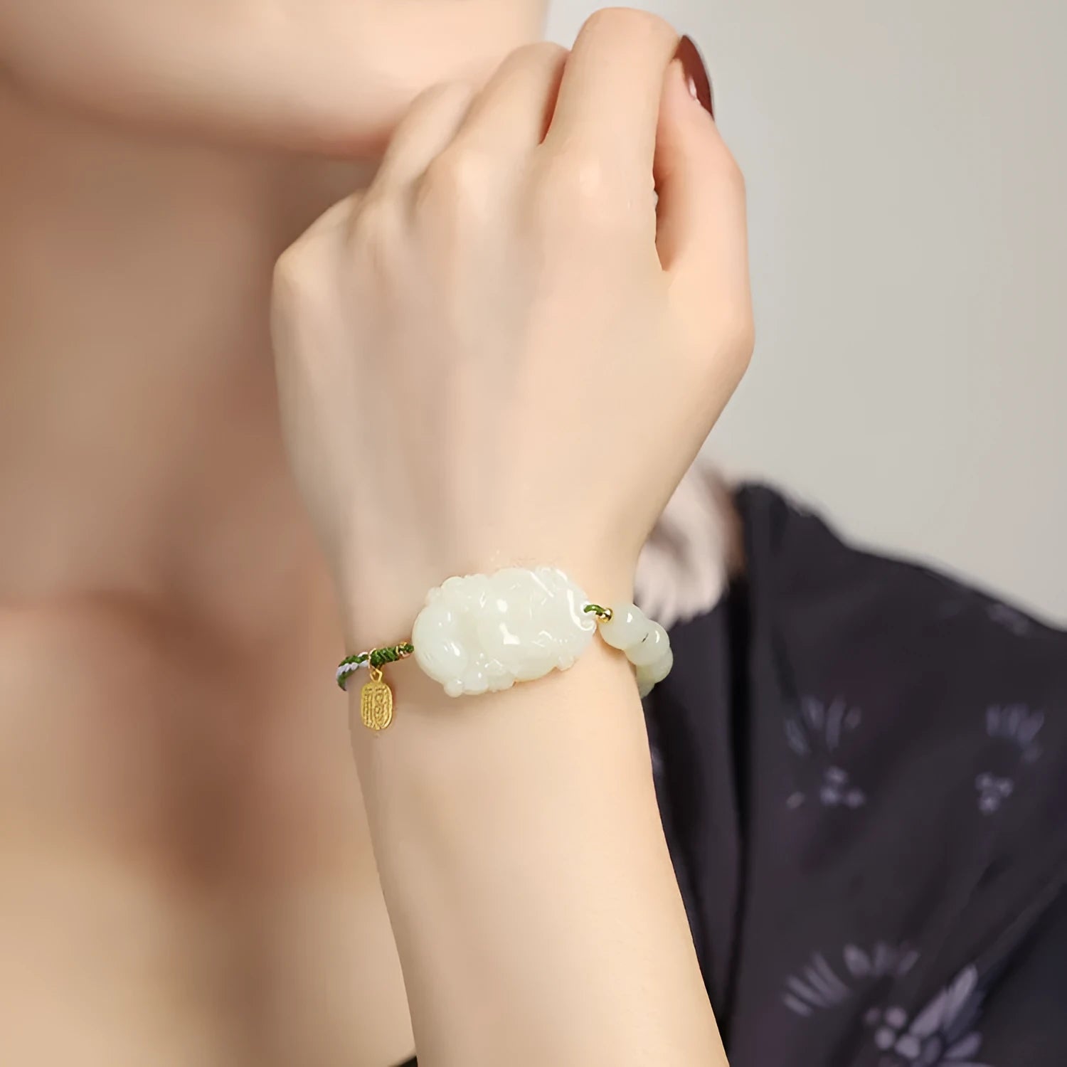 Hetian jade zodiac bracelet on red rope with S925 silver card for Chinese birth year animals.