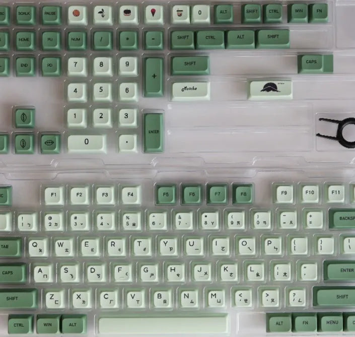 124-key matcha green PBT keycap set showing multiple international language layouts including Arabic and Korean.