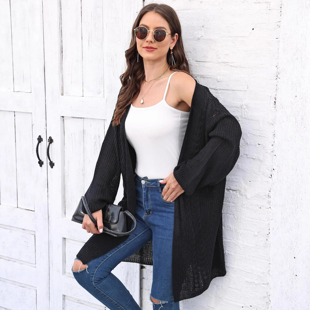 Women's loose longline acrylic cardigan sweater coat in a solid colour.