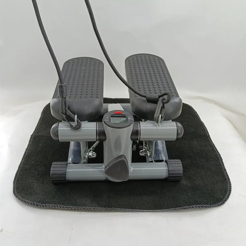 Silver grey household hydraulic pedal exercise machine for waist slimming and cardio.