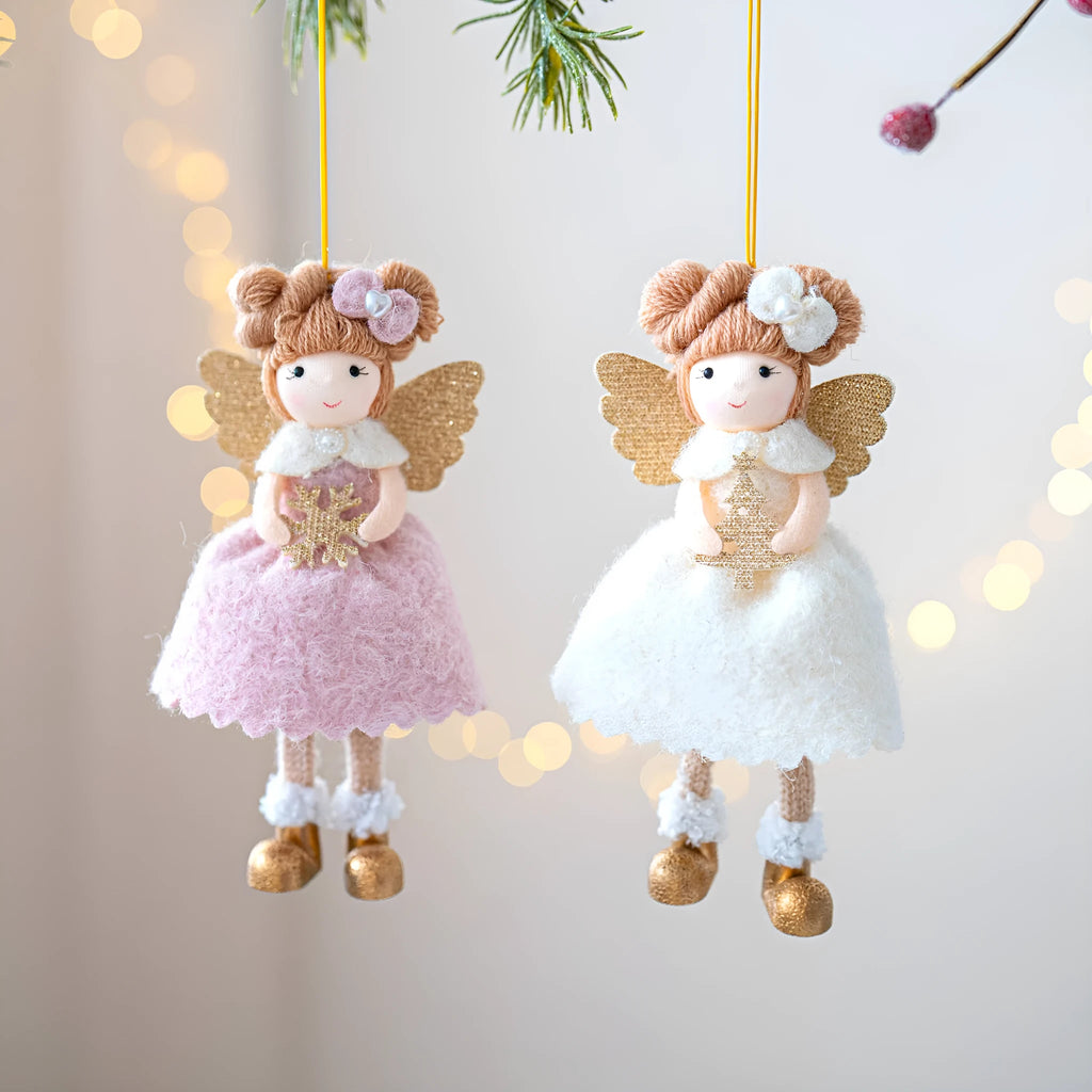 Pink and white cloth Christmas angel wings plush pendant decoration on a neutral background.