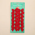 Red, gold, red gold, and silver 5 cm polyester Christmas decoration bows on a tree branch