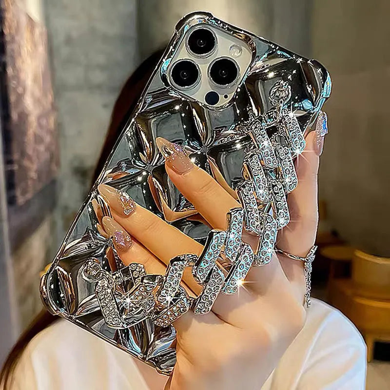 Silver iPhone case with a connected chain bracelet and a flash diamond lock clasp.