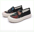 Women's Old Beijing slip-on canvas shoes in black with round toe and shallow mouth design on a white background.