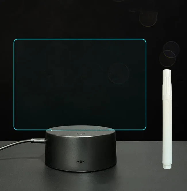 3D acrylic LED message board with touch control, black ABS base, USB cable, and stylus pen on desk
