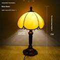 Beige bedside table lamp with simple modern design measuring 20cm wide