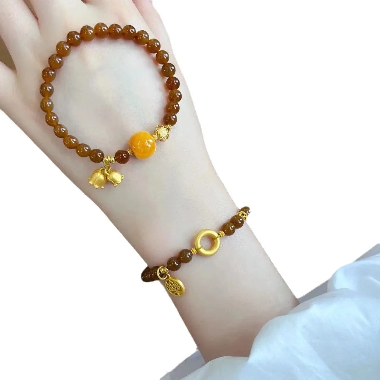 Caramel coloured electroplated women's bracelet with Lily flower design in mixed materials.