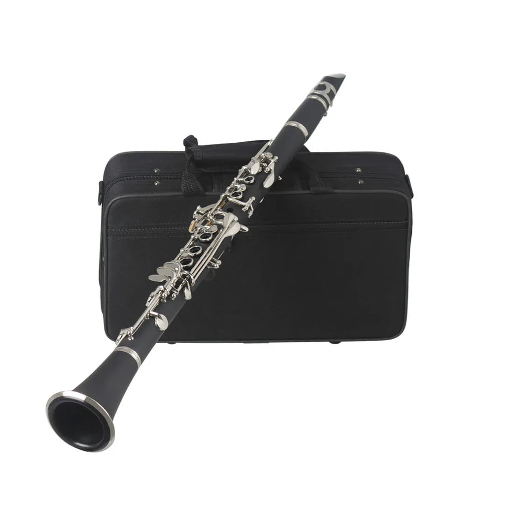 Black Bakelite clarinet with nickel-plated keys next to its protective carry bag.