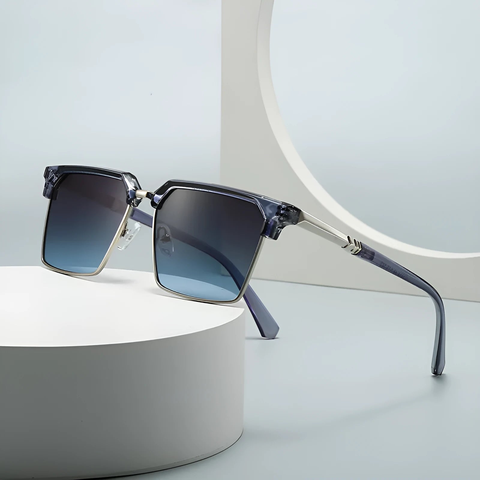 Man wearing square black plastic sunglasses with UV400 lenses, showing the box-style frame from the front.