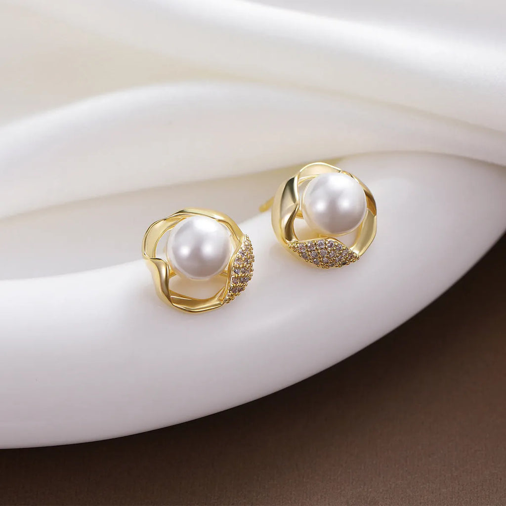 Beizhu zircon gold plated stud earrings in white colour on display