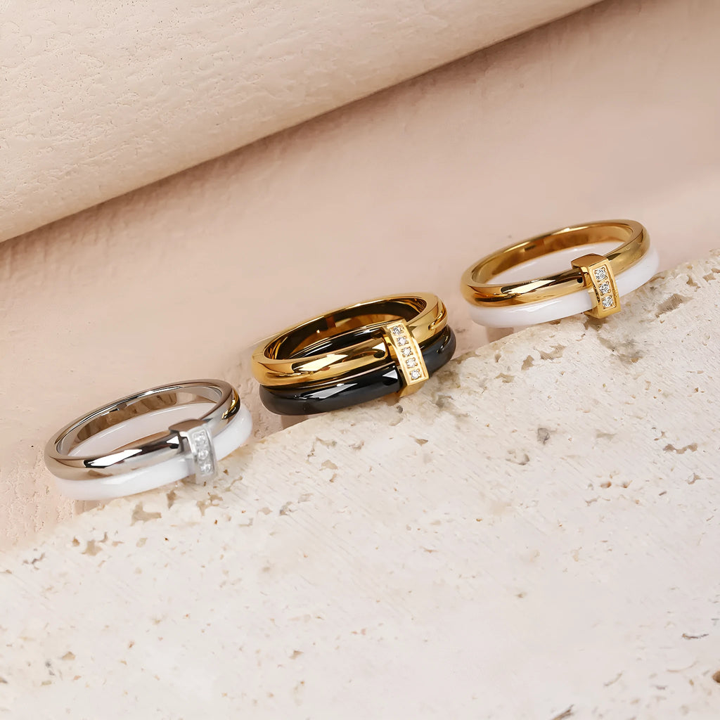 Women's titanium steel heart-shaped double ring with glossy stitching and inlaid zirconium stones.