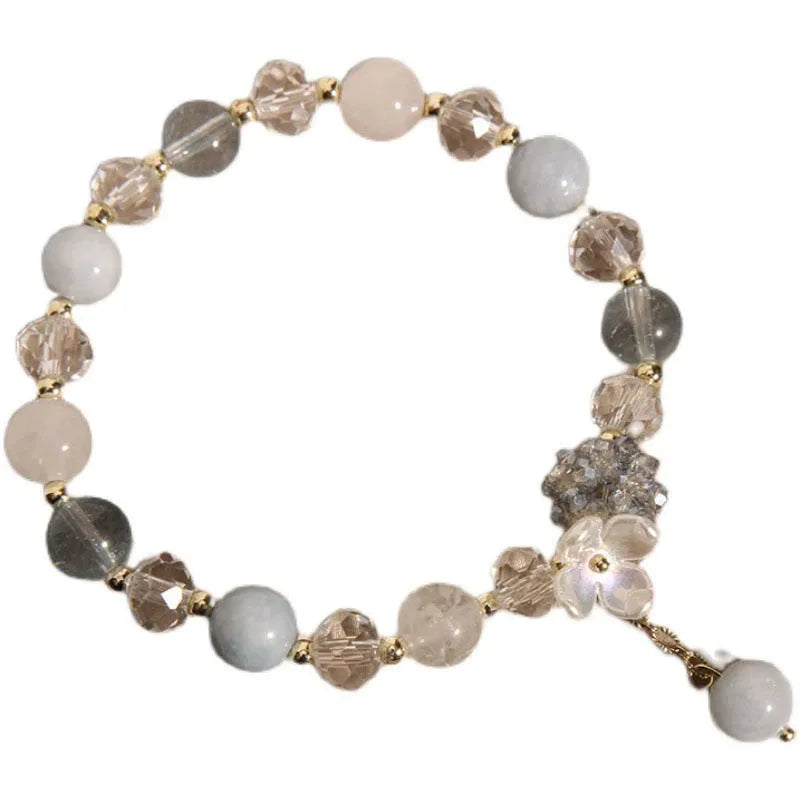 Woven aquamarine crystal bracelet with opal floral elements and cat motifs