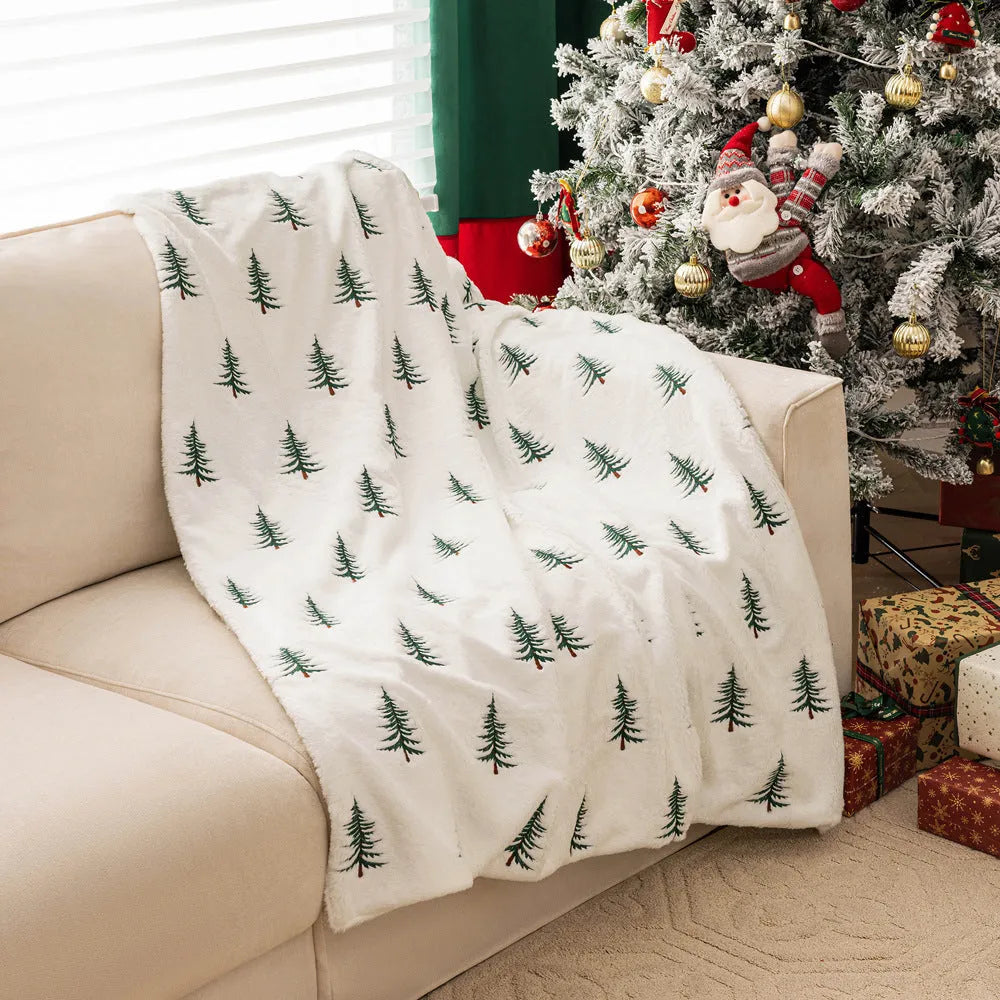 Christmas plush sofa blanket with embroidered tree design, white polyester, 127x152cm, on a sofa