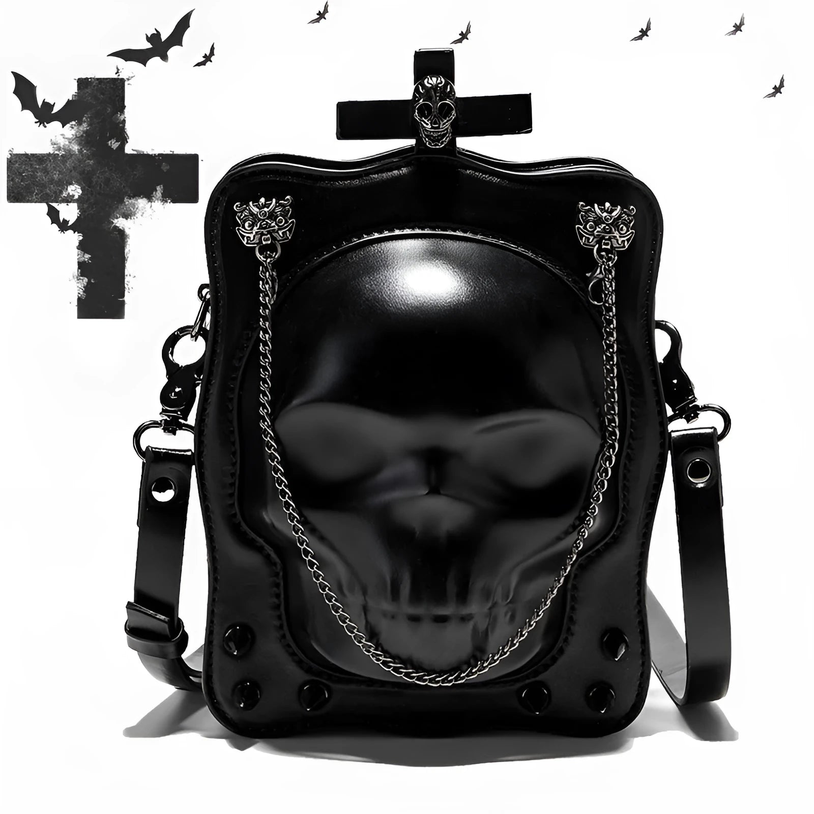 Black mini square crossbody bag with embossed skull design, metal rivets, chain strap, and top zipper.