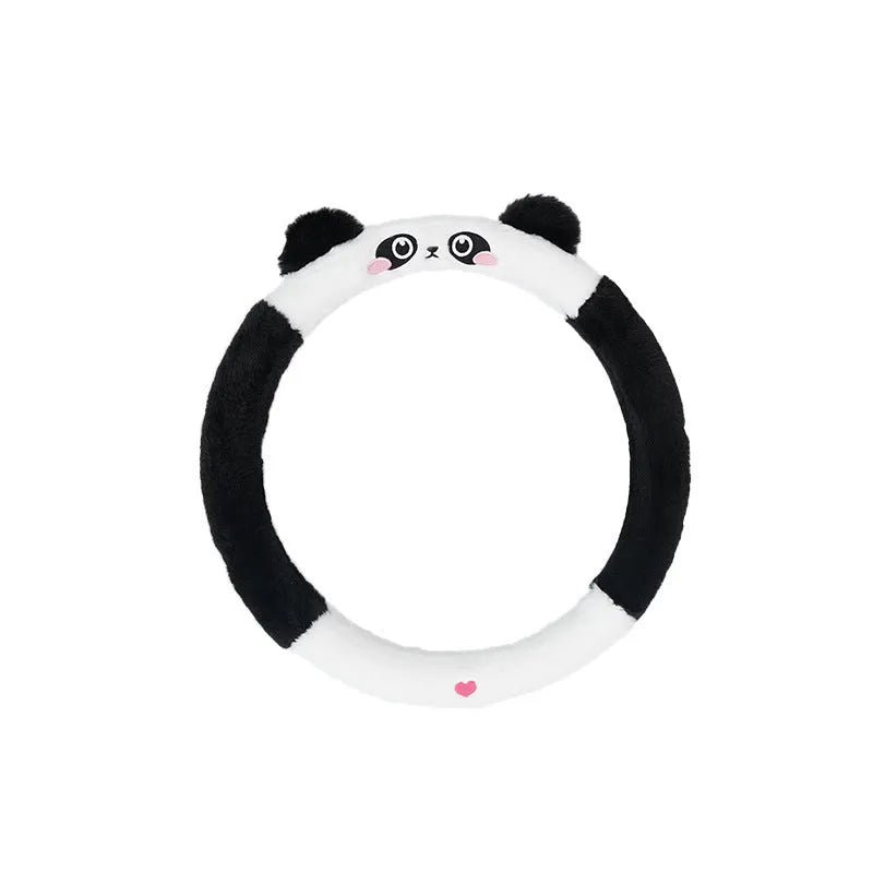 Plush winter steering wheel cover with embroidered bear design, shown on a car steering wheel.