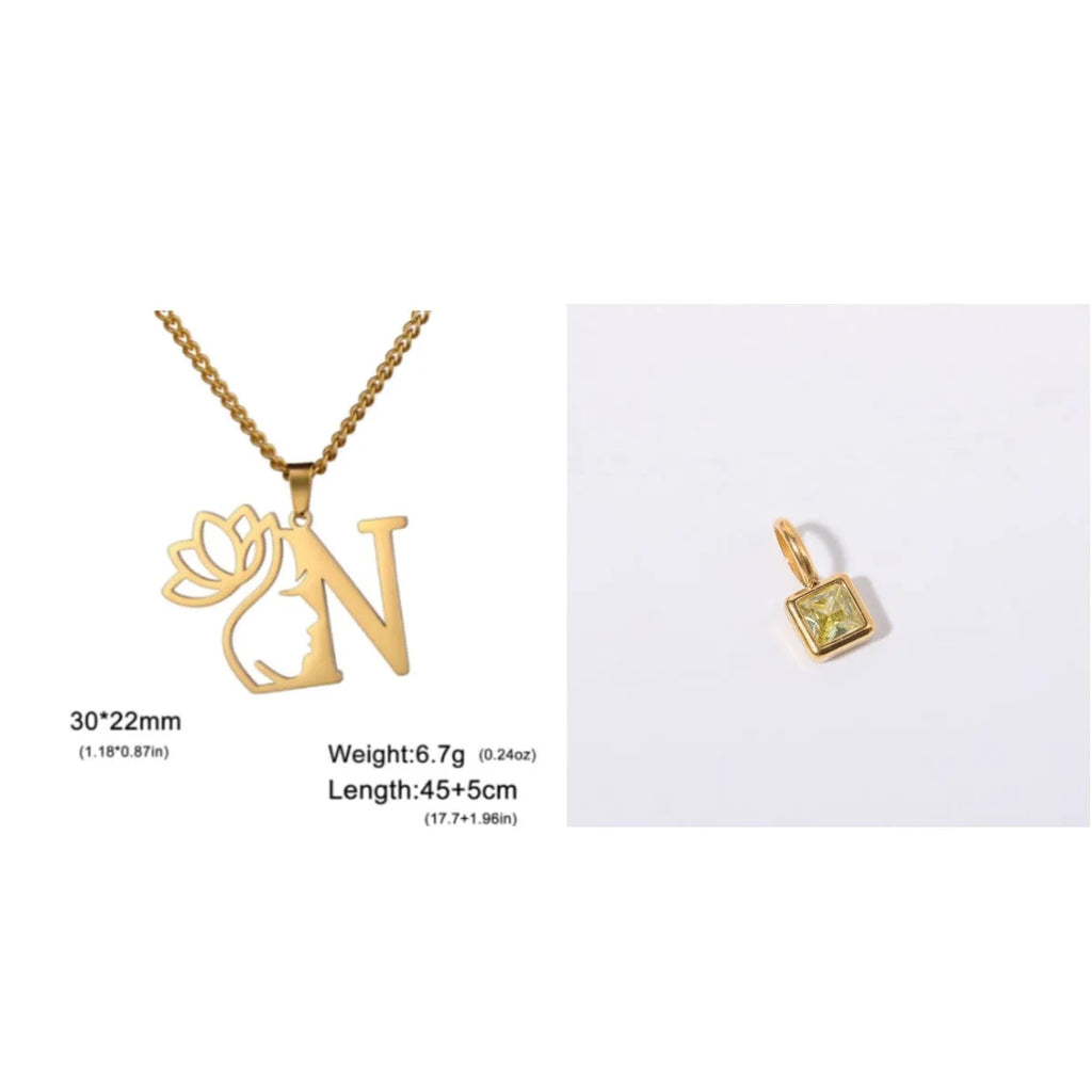 Gold electroplated stainless steel necklace with a cross chain and a letter 'A' pendant on a white background.
